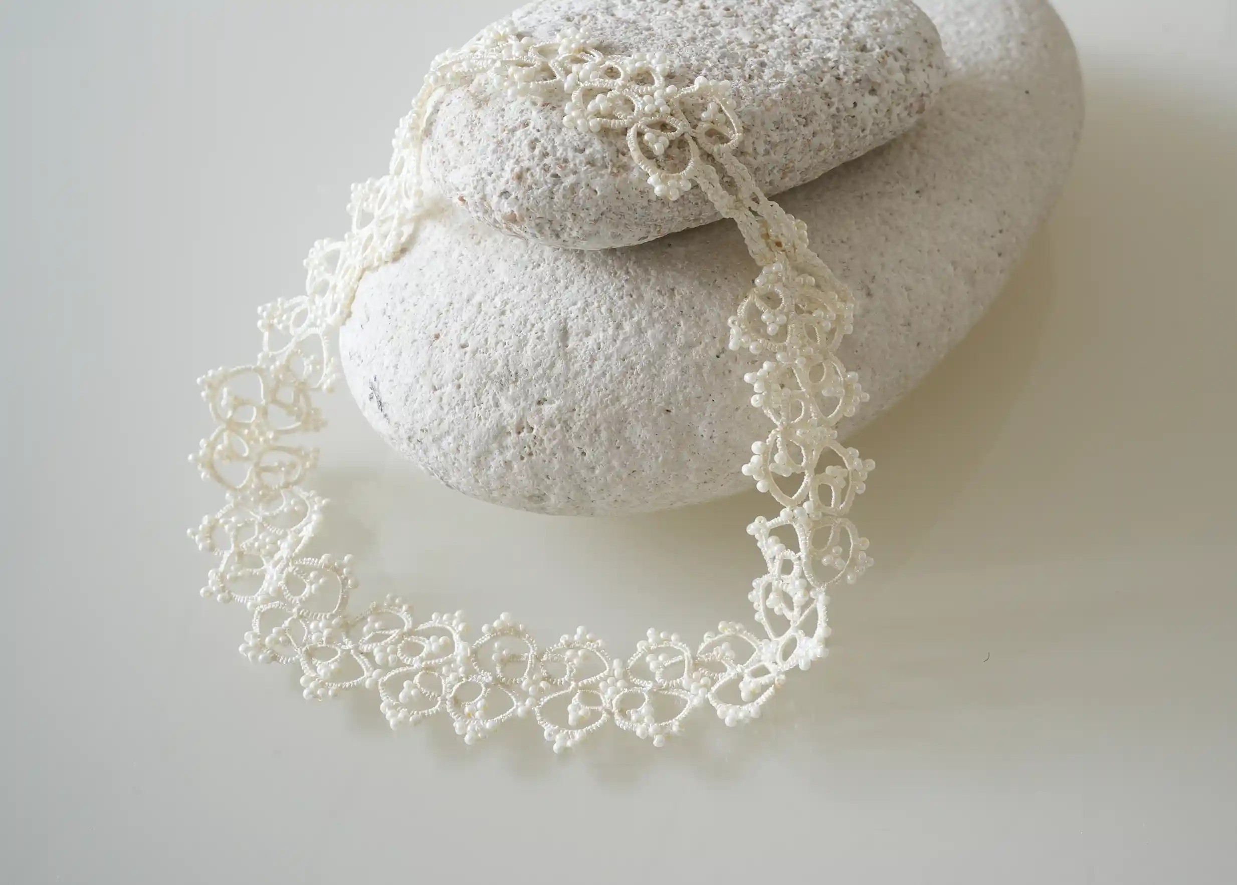 Close-up of the details of the handmade lace choker necklace