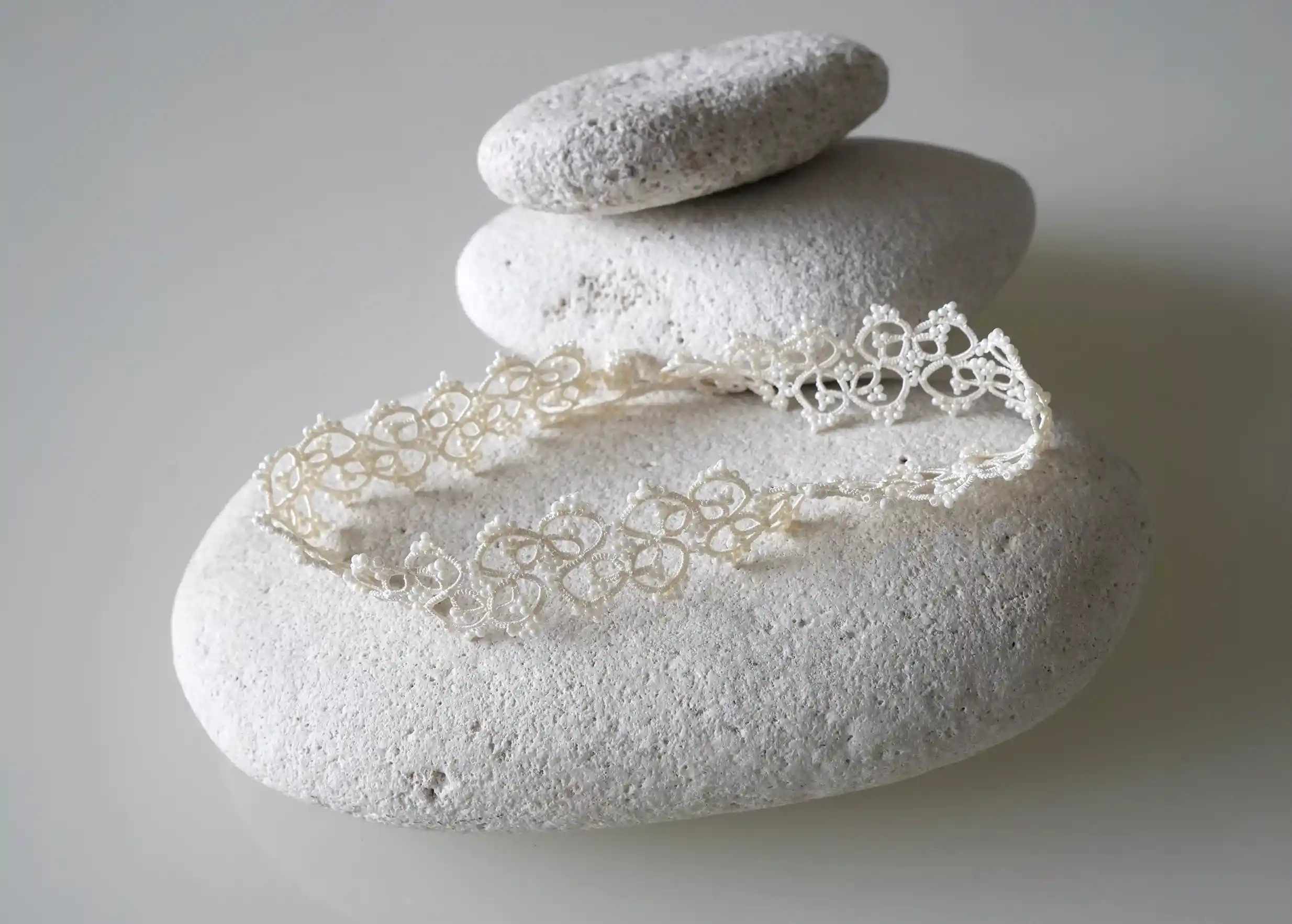 Lace choker necklace set on a pebble