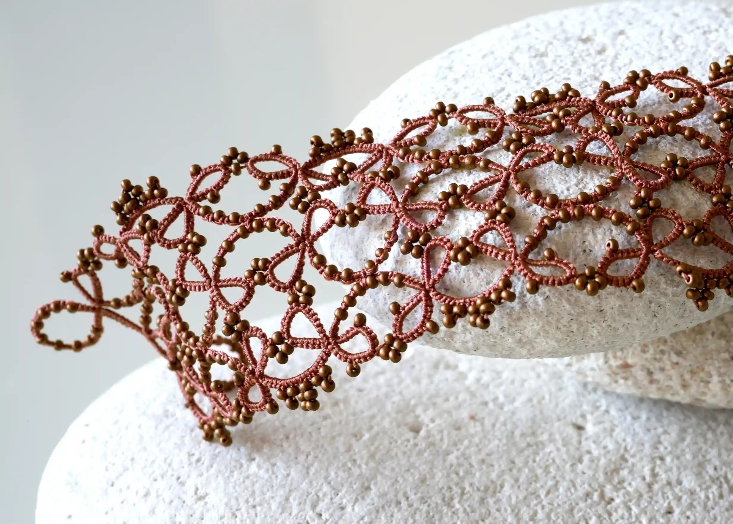 Focus on the details of the wide lace cuff bracelet from Karawan Authentic, Crown model