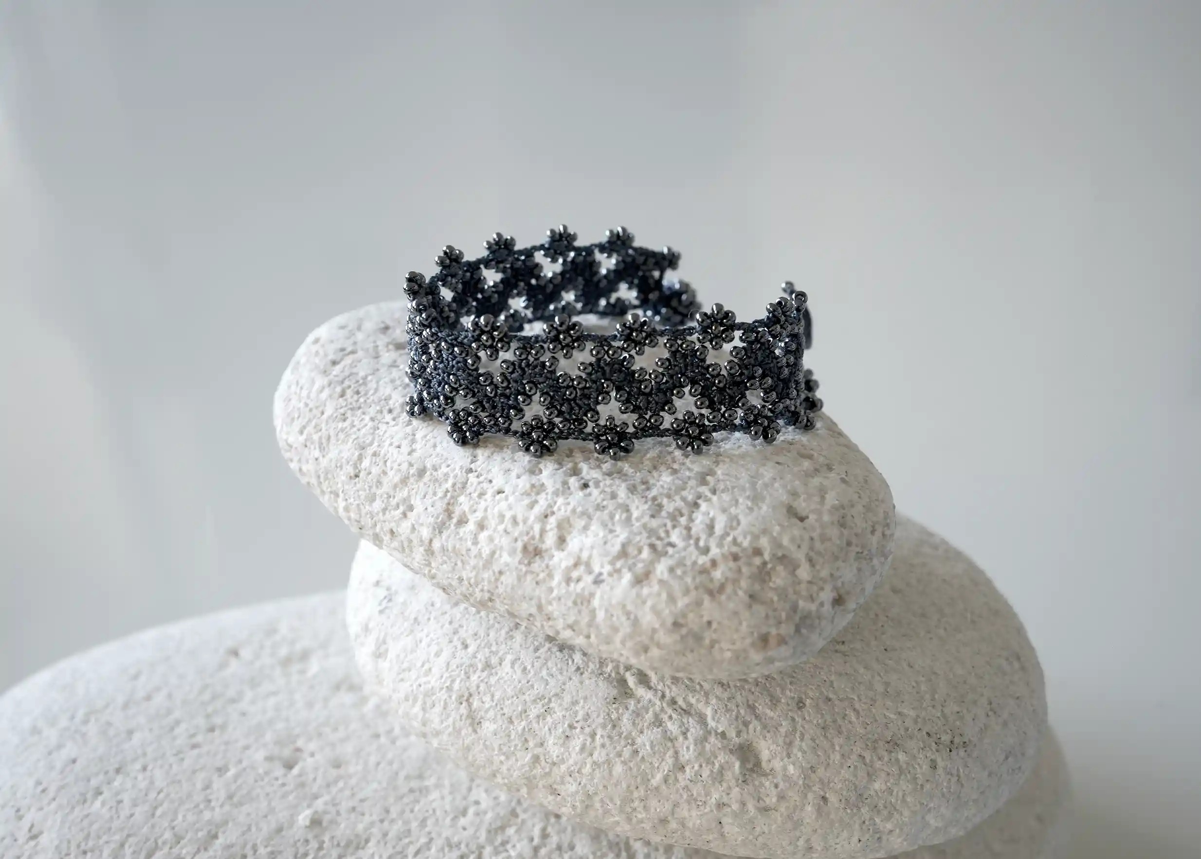 Textile bracelet made of thread and beads, with graphic patterns, Ribbon model in slate blue