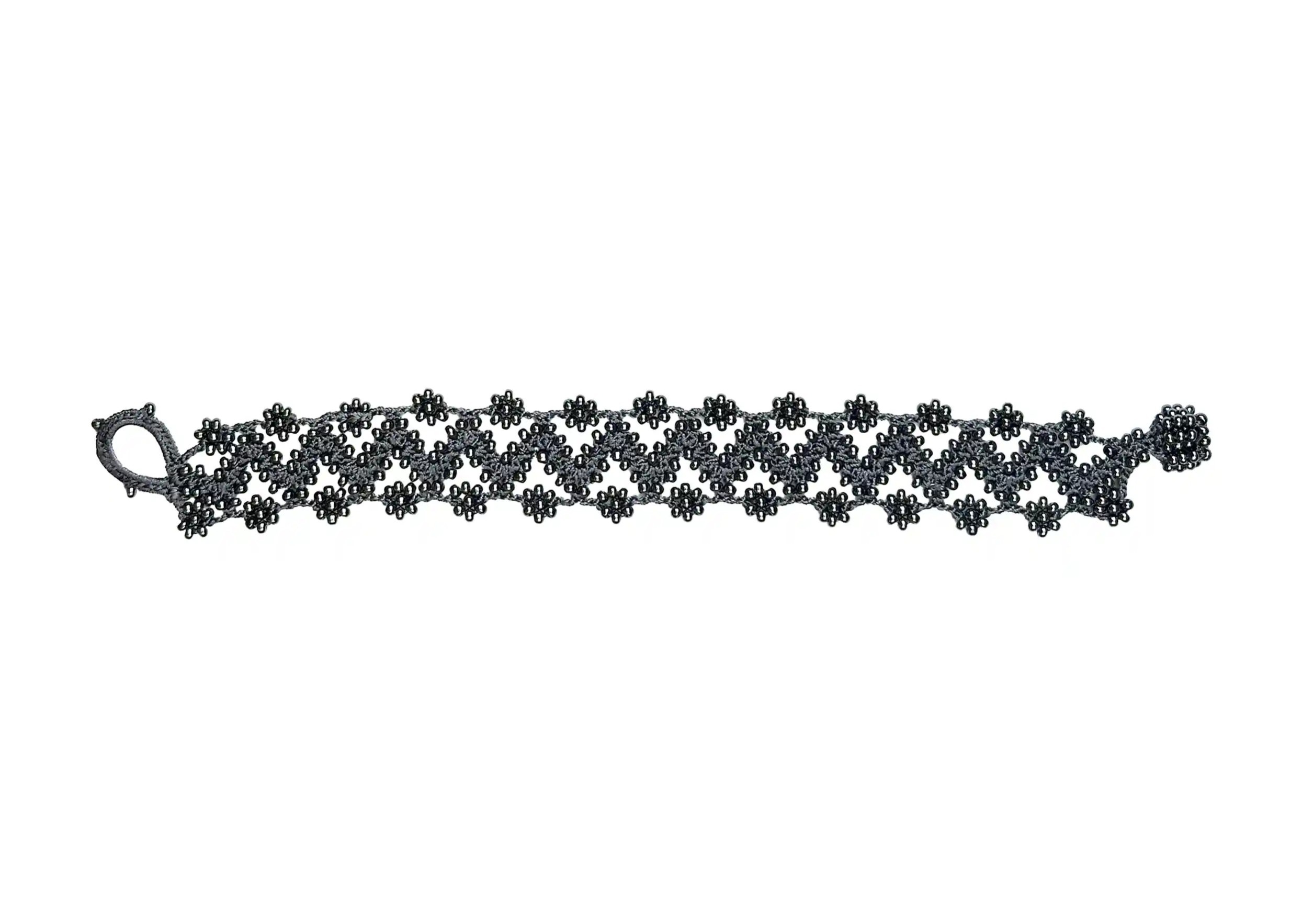 Textile bracelet made of thread and beads, Ribbon model in slate blue, photo taken against a white background