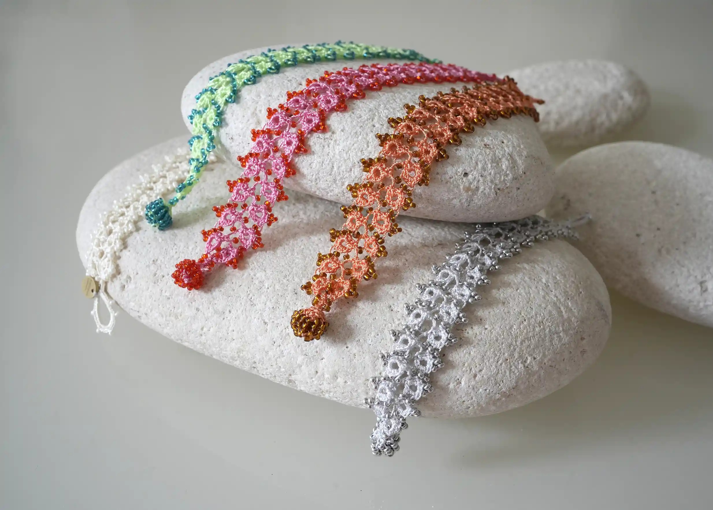 Set of handmade lace textile bracelets in light colours, Karawan Authentic brand