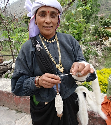 North Indian craftswoman spinning nettle by hand